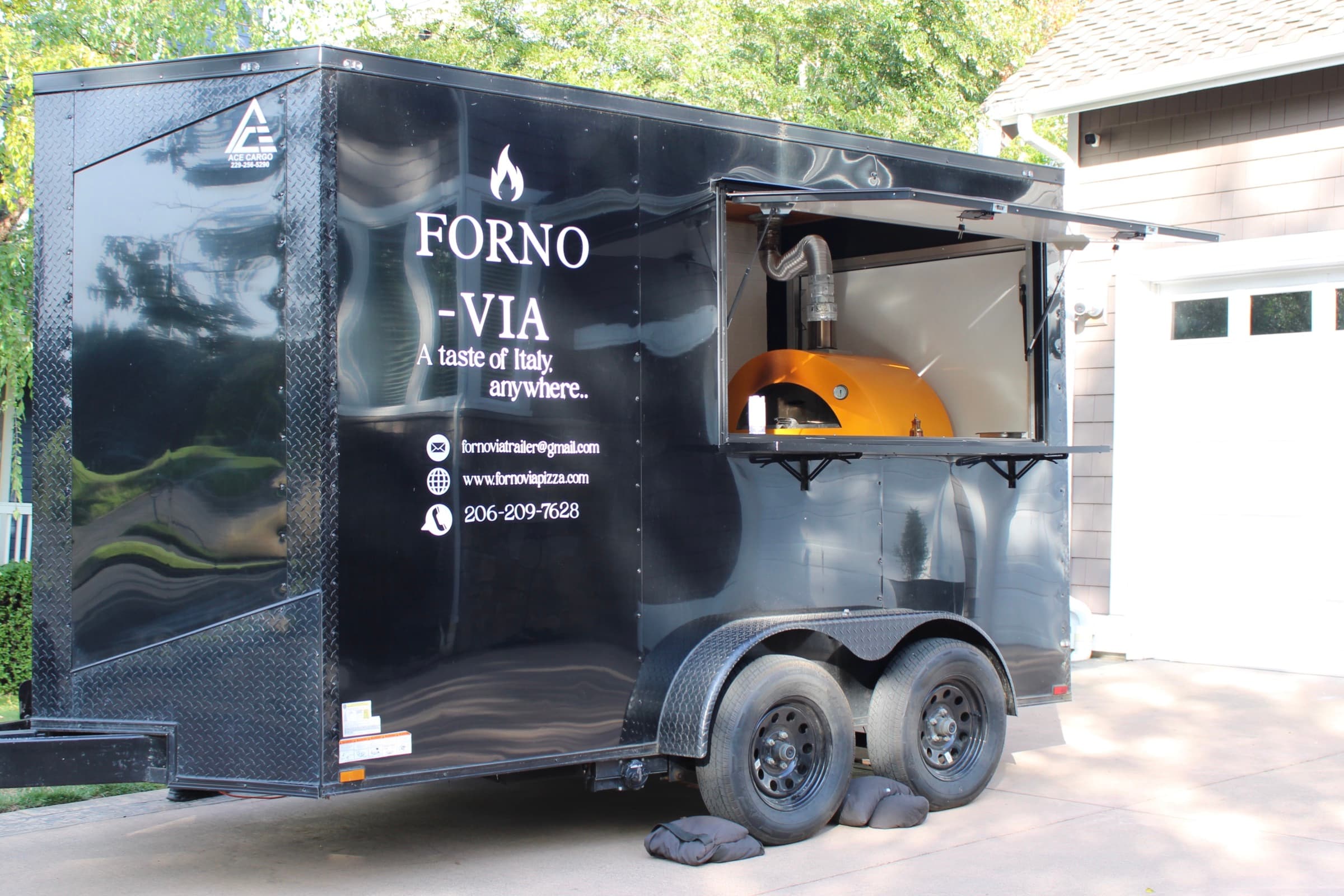 Forno Via mobile pizza trailer set up for an outdoor event