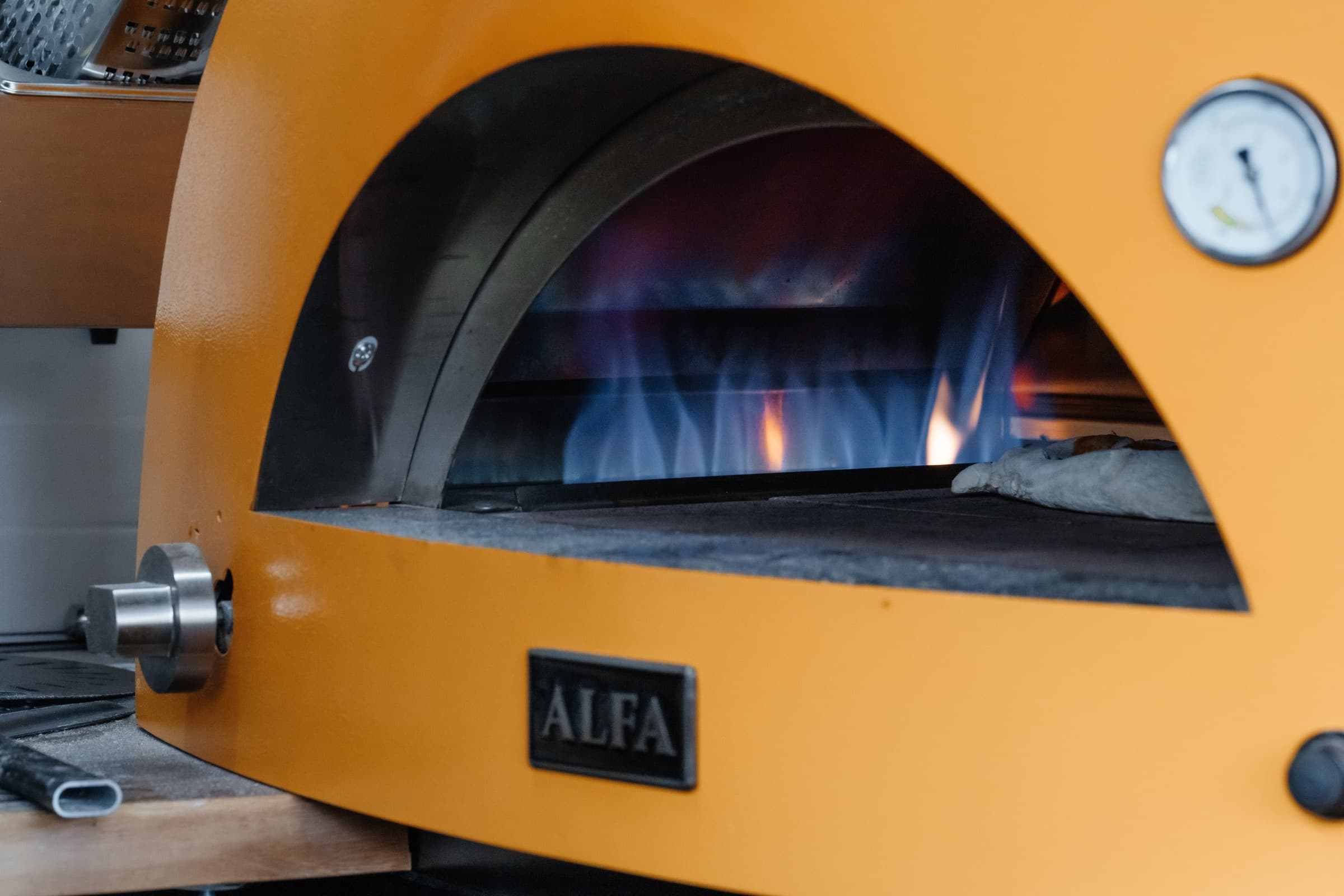 Flames inside the Forno Via wood-fired pizza oven