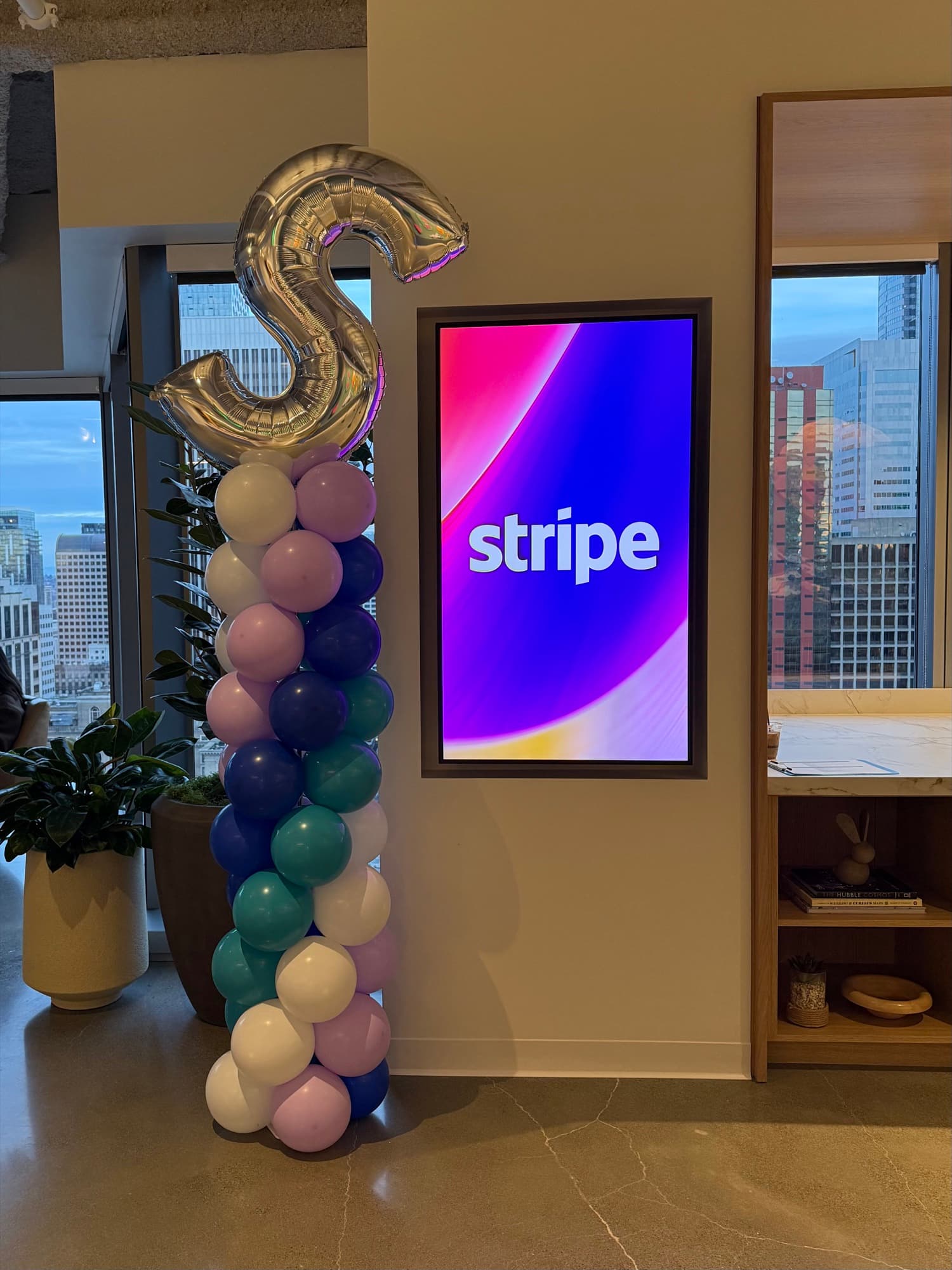 A colorful branded balloon installation created for a corporate event.